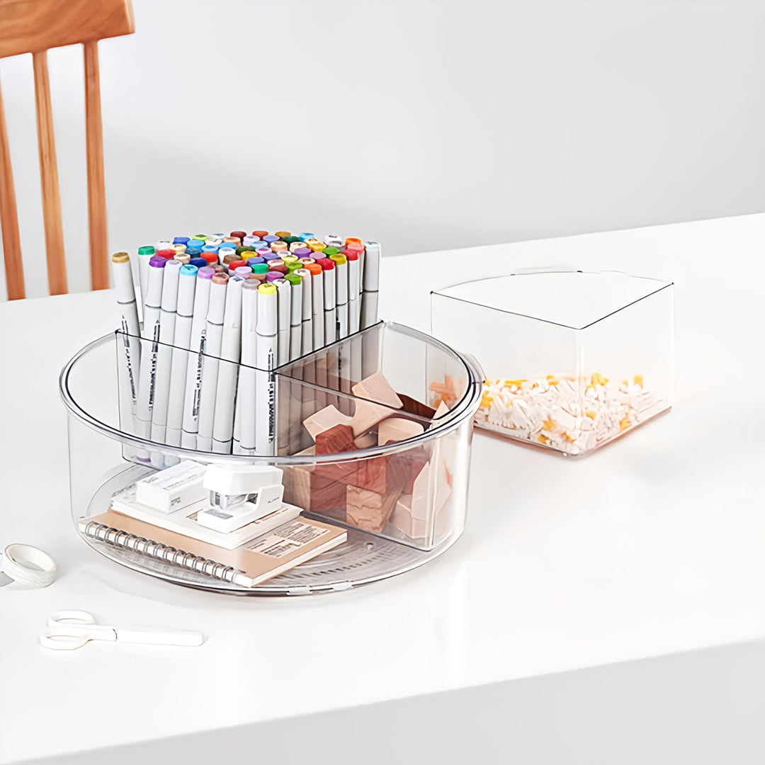 Clear plastic organizer with markers, blocks, and stationery on a white surface.