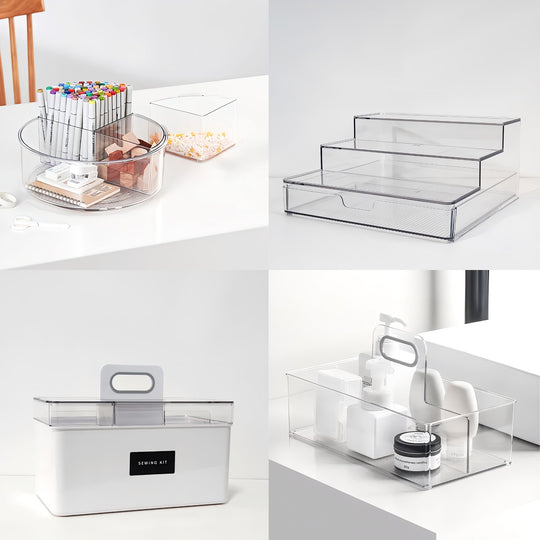 Clear acrylic storage boxes on a white surface with office supplies.